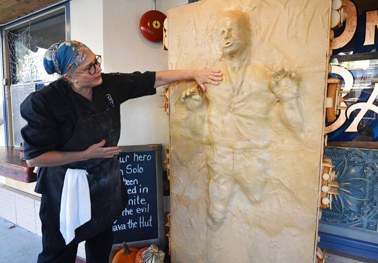 Catherine Pervan, with Our House Bakery in Benicia, Calif., talks about creating the life-sized Han Solo on Oct. 13, 2022  The piece is the bakery's entry in the downtown Benicia scarecrow contest.