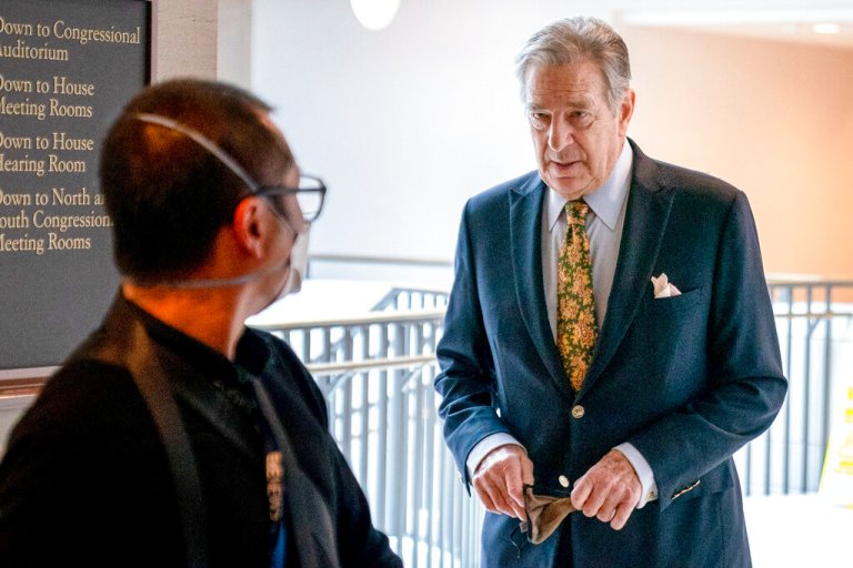 Paul Pelosi, right, the husband of House Speaker Nancy Pelosi, of California, follows his wife as she arrives for her weekly news conference on Capitol Hill in Washington on March 17.
