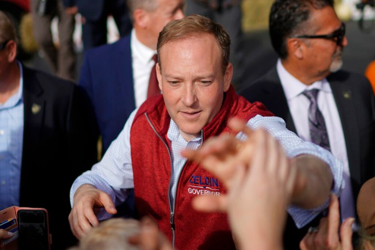 Republican gubernatorial candidate Lee Zeldin greets supporters at the end of a campaign rally on Monday, Oct. 31, 2022, in Westchester, New York. 