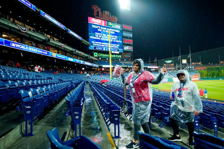 Fans leave Citizens Bank Park before Game 3 of baseball's World Series between the Houston Astros and the Philadelphia Phillies in Philadelphia.
