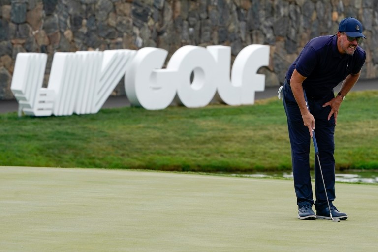 Phil Mickelson lines up a shot on the 18th hole during the first round of the Bedminster Invitational LIV Golf tournament in Bedminster, New Jersey, July 29, 2022. 