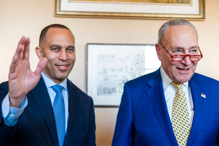 House Minority Leader-elect Rep. Hakeem Jeffries, D-N.Y., left, waves, after meeting with Senate Majority Leader Chuck Schumer of N.Y., Wednesday, Dec. 21, 2022, on Capitol Hill in Washington. 