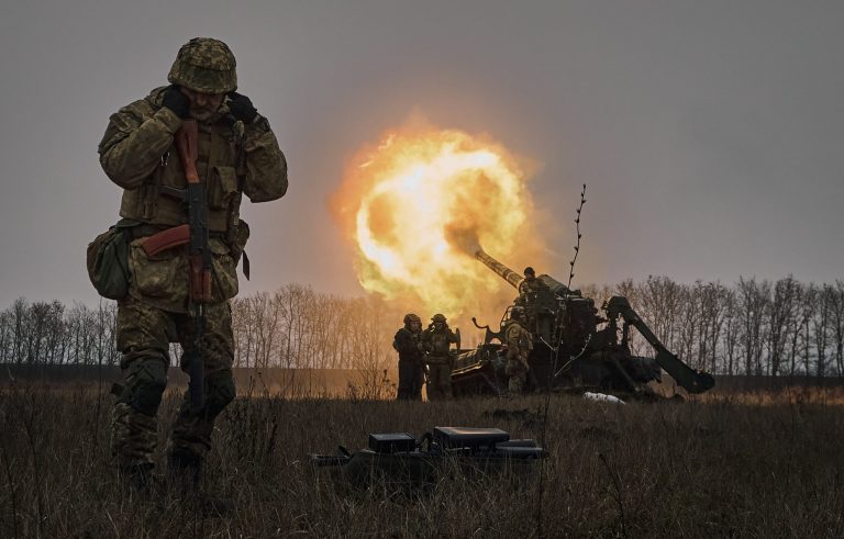 Ukrainian soldiers fire a Pion artillery system at Russian positions near Bakhmut, Donetsk region, Ukraine, Friday, Dec. 16, 2022.