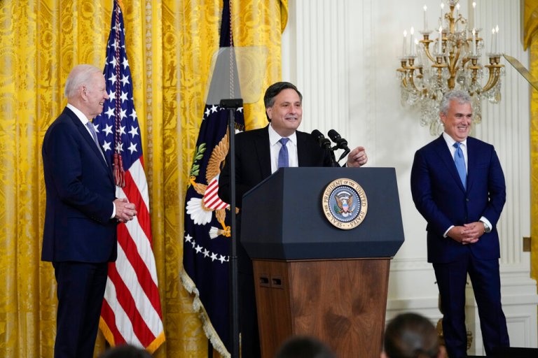 President Joe Biden applauds during an event to thank outgoing White House chief of staff Ron Klain, center, in the East Room of the White House in Washington, Wednesday, Feb. 1, 2023. At right is incoming chief of staff Jeff Zients.