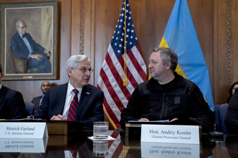 Garland says ‘war criminals will find no refuge’ in US during surprise trip to Ukraine