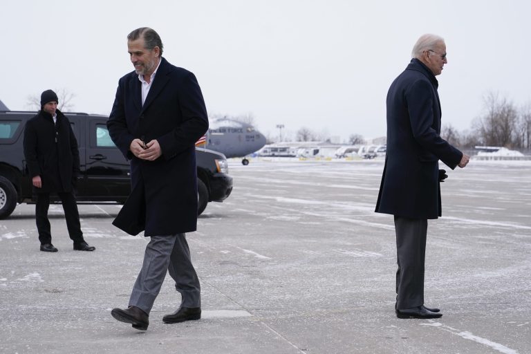 Hunter Biden, left, son of President Joe Biden, walks to a motorcade vehicle as President Biden pauses to speak with greeters on the tarmac after stepping off Air Force One, Saturday, Feb. 4, 2023, at Hancock Field Air National Guard Base in Syracuse, N.Y. 