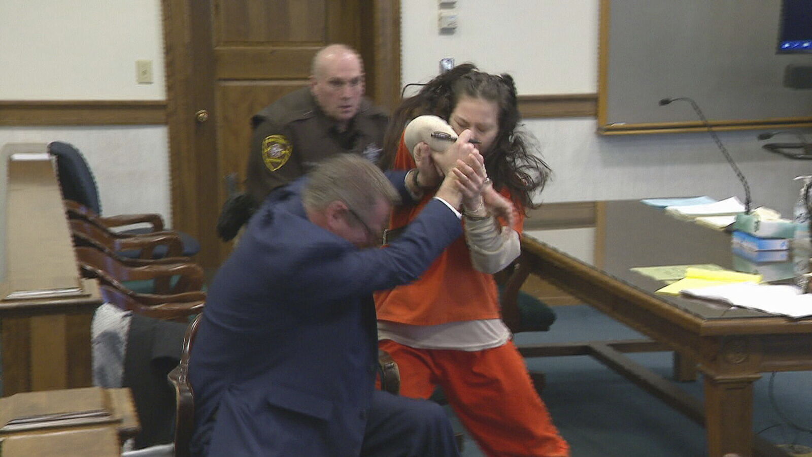 WATCH: Woman accused of dismembering murder victim attacks lawyer in court