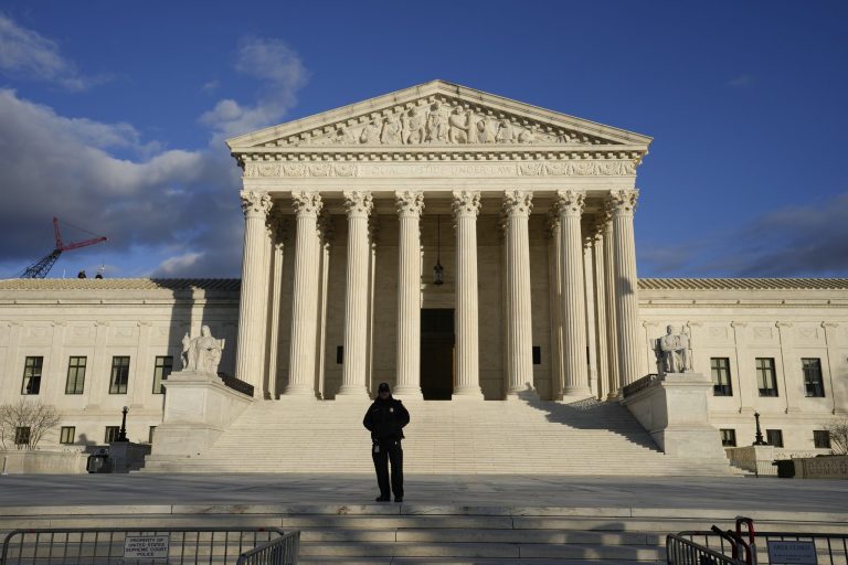 Security stands outside the U.S. Supreme Court, Jan. 20, 2023, in Washington. 