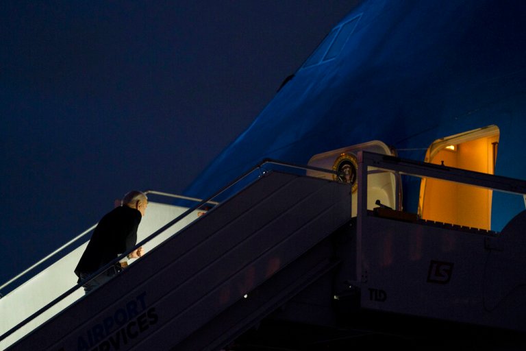 President Joe Biden appears to stumble and recover as he boards Air Force One at Warsaw Chopin International Airport, Wednesday, Feb. 22, 2023, in Warsaw.
