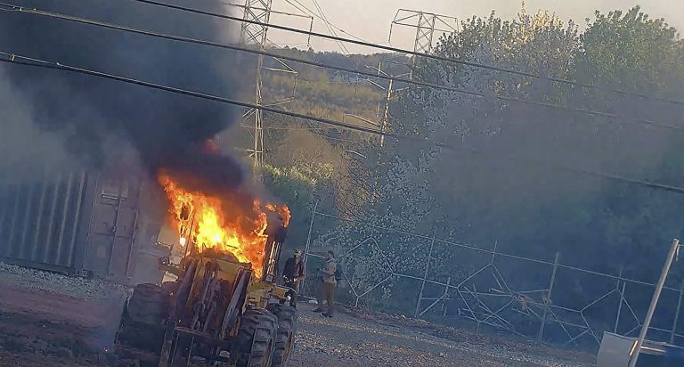 This image provided by the Atlanta Police Department shows construction equipment set on fire Saturday, March 4, 2023, by a group protesting the planned public safety training center, according to police. 