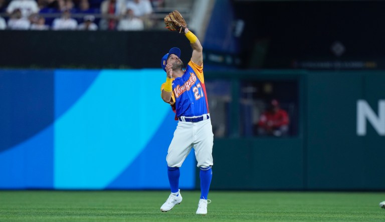 Venezuela second baseman Jose Altuve catches a ball hit by Dominican Republic's Teoscar Hernandez during the first inning of a World Baseball Classic game, Saturday, March 11, 2023, in Miami.