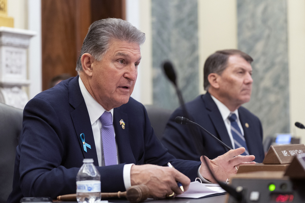 Manchin threatens to sue Treasury over electric vehicle tax credits