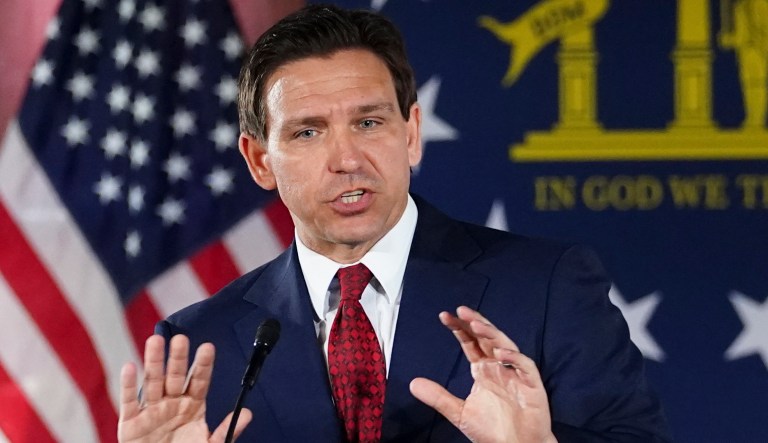 FILE - Florida Gov. Ron DeSantis speaks to a crowd at Adventure Outdoors gun store, Thursday, March 30, 2023, in Smyrna, Ga.