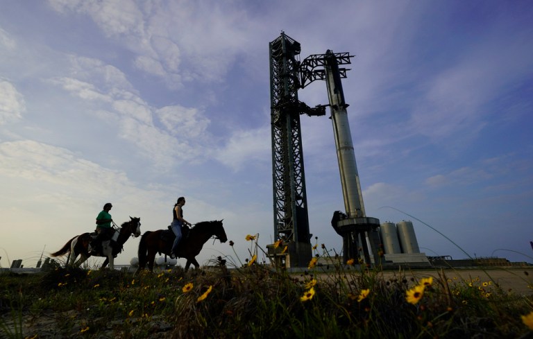 NASA astronaut Sunita Williams, left, and Haley Esparza, ride horseback as they visit SpaceX's Starship as it is readied for launch at Starbase in Boca Chica, Texas, Wednesday, April 19, 2023. 