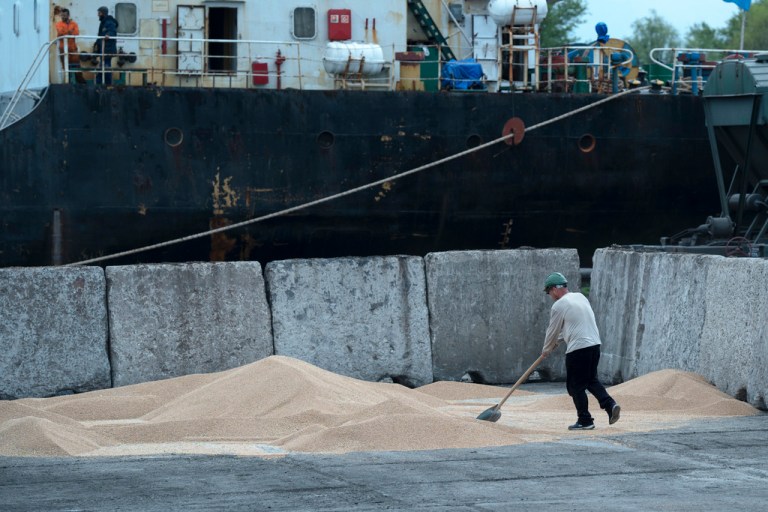 Workers load grain at a grain port in Izmail, Ukraine, Wednesday, April 26, 2023. U.S. and European officials have toured Ukraine's southern port of Izmail, a facility that is important in bringing Ukrainian grain exports to the world. It could become critical if a deal with Russia to allow grain exports from Ukrainian Black Sea ports expires without being renewed. 