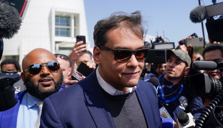 U.S. Rep. George Santos leaves the federal courthouse in Central Islip, N.Y., Wednesday, May 10, 2023. 