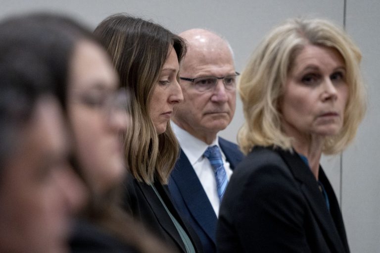 Dr. Caitlin Bernard, left, sits between attorneys John Hoover and Alice Morical on Thursday, May 25, 2023, before a hearing in front of the state medical board at the Indiana Government South building in downtown Indianapolis.