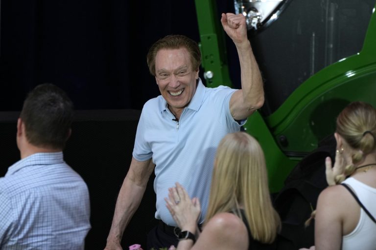 Republican presidential candidate and author Perry Johnson makes his way to the stage to speak at Sen. Joni Ernst's Roast and Ride on Saturday, June 3, 2023, in Des Moines, Iowa.