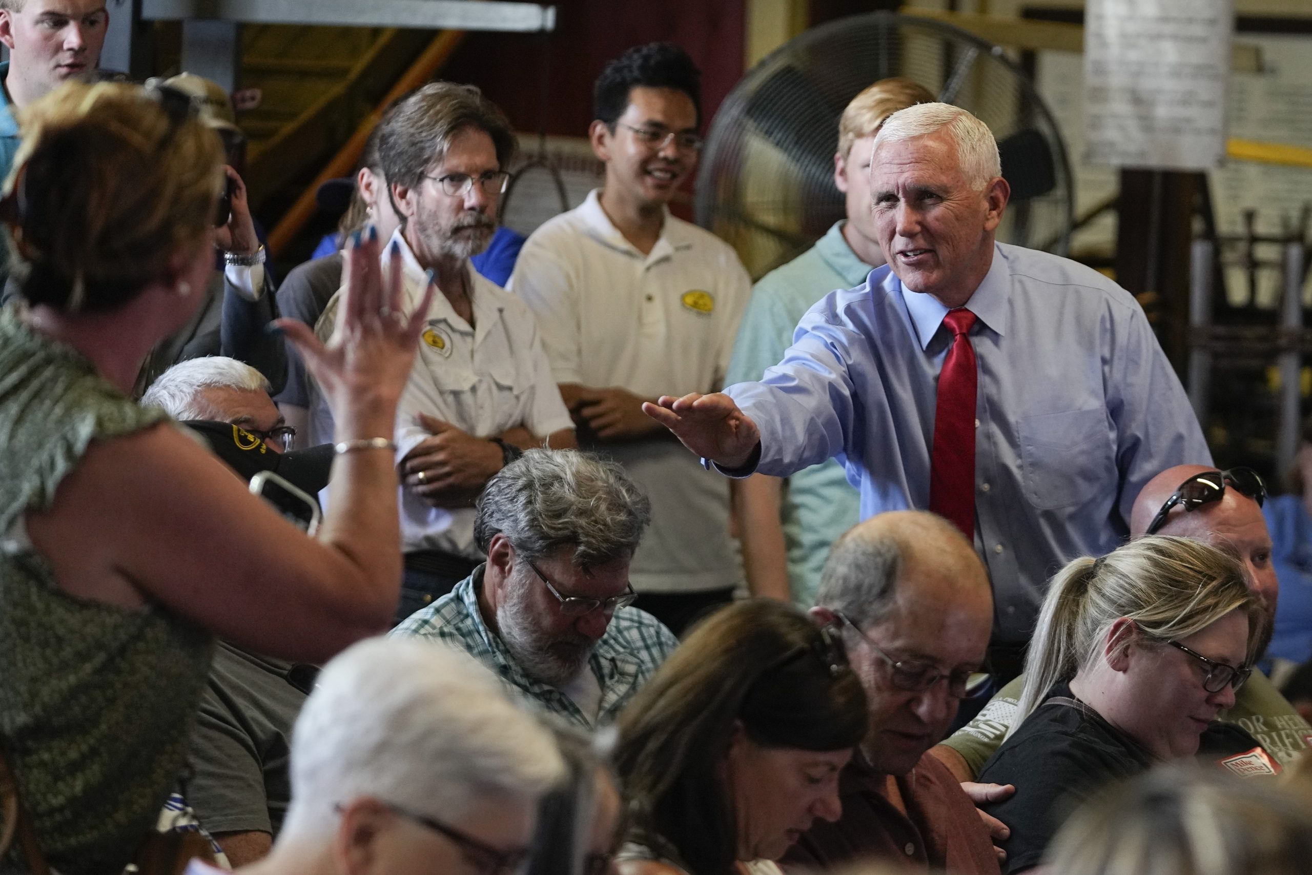 Pence spars with Trump supporters confronting him on campaign trail