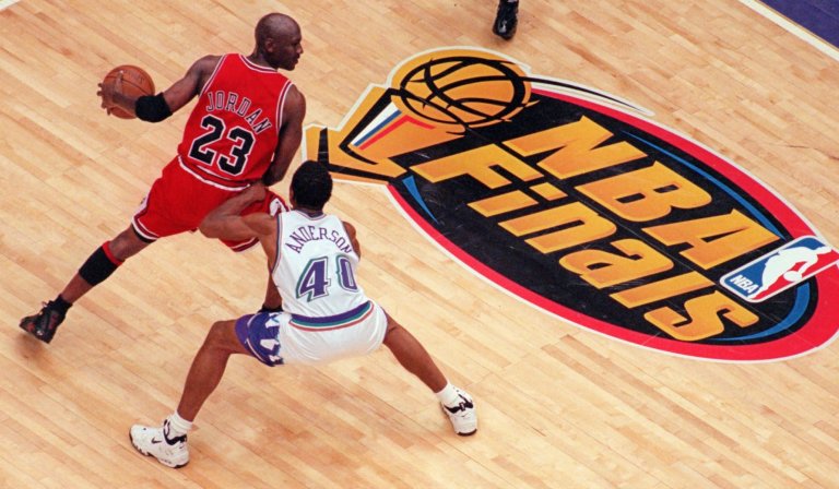 Michael Jordan being guarded in the NBA Finals.