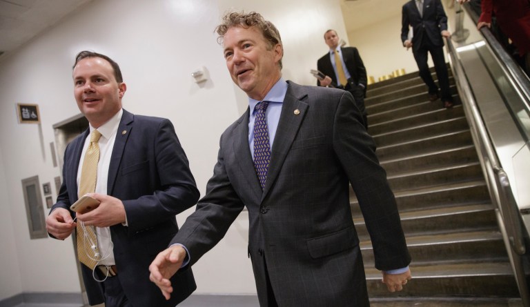 Sen. Rand Paul, R-Ky., center, and Sen. Mike Lee, R-Utah, left, return to their offices after votes to confirm two of President Donald Trumpâs cabinet picks, on Capitol Hill in Washington, Thursday, March 2, 2017.