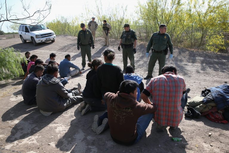MISSION, TX - APRIL 11:  U.S. Border Patrol agents detain undocumented immigrants near the U.S.-Mexico border on April 11, 2013 near Mission, Texas. A group of 16 immigrants from Mexico and El Salvador said they crossed the Rio Grande River from Mexico into Texas during the morning hours before they were caught. The Rio Grande Valley sector of has seen more than a 50 percent increase in illegal immigrant crossings from last year, according to the Border Patrol. Agents say they have also seen an additional surge in immigrant traffic since immigration reform negotiations began this year in Washington D.C. Proposed refoms could provide a path to citizenship for many of the estimated 11 million undocumented workers living in the United States. Photo by John Moore/Getty Images)  (Photo by John Moore/Getty Images)