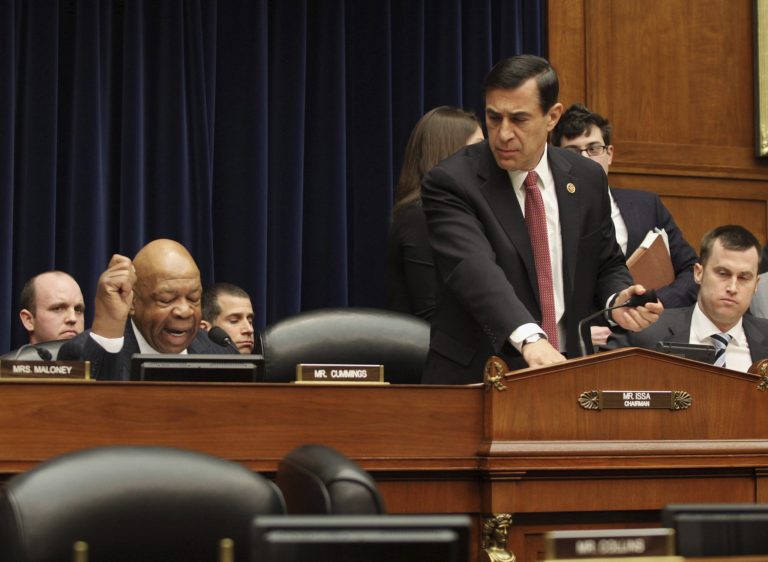 House Oversight and Government Reform Committee Chairman Rep. Darrell Issa, R-Calif., right, leaves as the committee's ranking member Rep. Elijah Cummings, D-Md., left, begins his statement on Capitol Hill in Washington, Wednesday, March 5, 2014, during the committee's hearing where former Internal Revenue Service (IRS) official Lois Lerner invoked her constitutional right not to incriminate herself. (AP Photo/Lauren Victoria Burke)