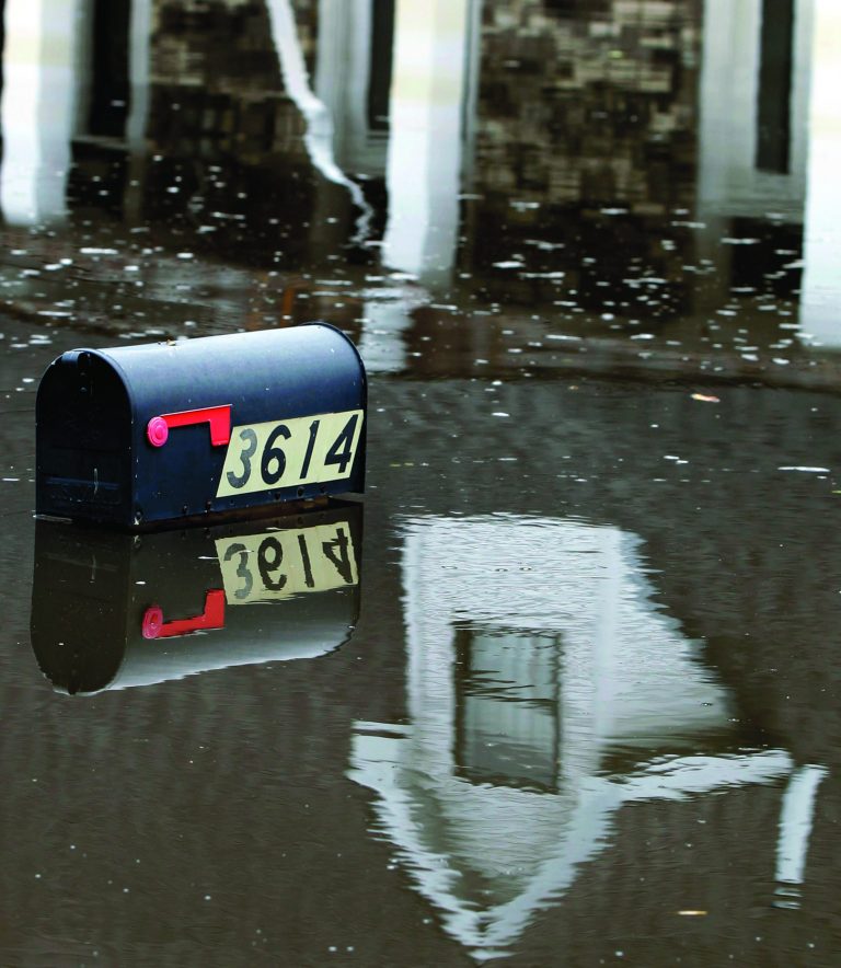 A mailbox peeks above floodwaters from Hurricane Isaac in Braithwaite, La., Sunday, Sept. 2, 2012. More than 200,000 people across Louisiana still didn't have any power five days after Hurricane Isaac ravaged the state. Thousands of evacuees remained at shelters or bunked with friends or relatives. (AP Photo/Gerald Herbert)