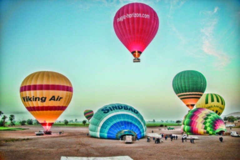 In this image made available by Christopher Michel, the launch site near Luxor in Egypt, shortly prior to a hot air balloon explosion which killed at least 18 tourists including a number of tourists Tuesday Feb. 26, 2013. Witnesses described hearing a loud explosion before seeing plumes of smoke as the balloon caught fire and plunged into a sugar cane field west of Luxor, which is 320 miles (510km) south of the capital Cairo. The casualties are believed to include British and French tourists, as well as other nationalities, a security official in the country said. (AP Photo/Christopher Michel)