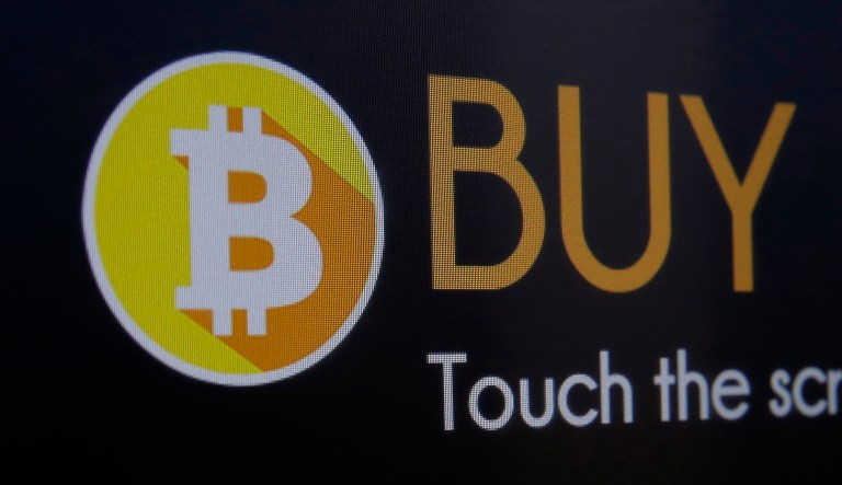 The regulators' action comes just days after top regulators warned investors that they are watching closely for the possibility of fraud and scams in the rush toward cryptocurrencies like bitcoin and ethereum. (AP Photo/Kin Cheung)