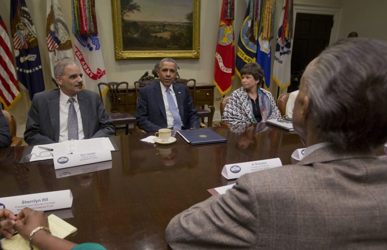 President Barack Obama meets with African American Civil Rights group leaders in the Roosevelt Room of the White House in Washington, Tuesday, Feb. 18, 2014. From left are, Attorney General, Eric Holder, the president and White House Senior Adviser Valerie Jarrett. Across the table is Rev. Al Sharpton, Founder and President, National Action Network. (AP Photo/Pablo Martinez Monsivais)