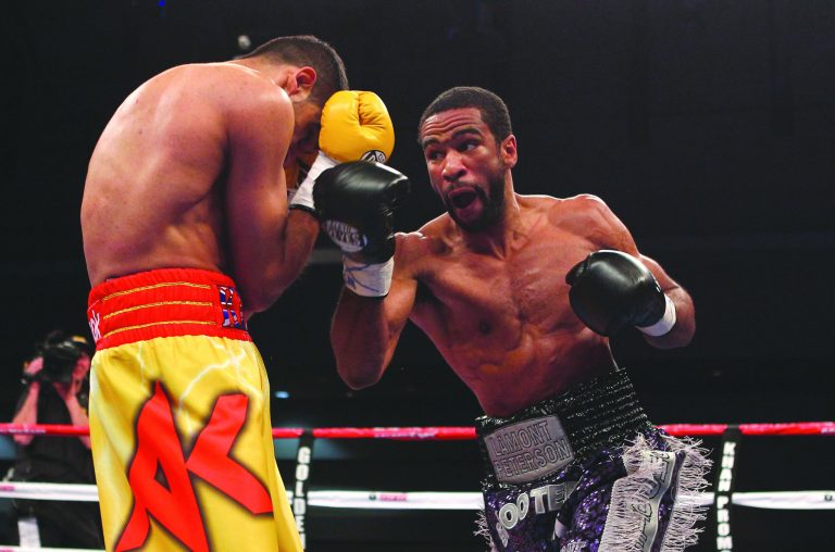 Al Bello/Getty Images
The District's Lamont Peterson beat Amir Khan for two world titles in 2011 but was stripped by the WBA after a positive drug test.