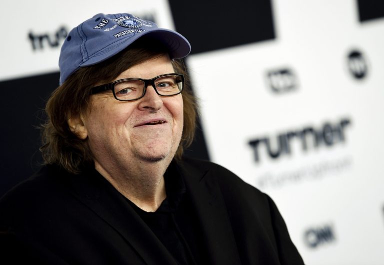 FILE - In this May 17, 2017 file photo, filmmaker Michael Moore attends the Turner Network 2017 Upfront presentation in New York. The Oscar-winning documentary filmmaker expressed his frustration at the New York premiere for 