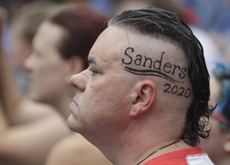 A supporter of U.S. Sen. Bernie Sanders listens during a rally Monday, Aug. 21, 2017, in Indianapolis. (AP Photo/Darron Cummings)