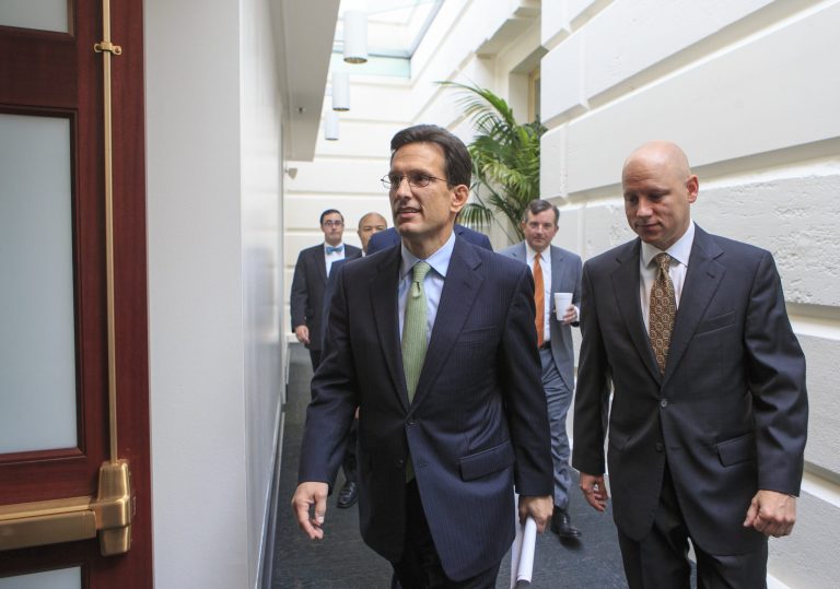   In this Sept. 10, 2013, photo, House Majority Leader Eric Cantor, R-Va., walks to a Republican strategy session at the Capitol, in Washington. A revolt by tea party conservatives forced House GOP leaders on Wednesday, Sept. 11, to delay a vote on a temporary spending bill required to prevent a government shutdown next month. The plan by top Republicans like Cantor is designed to keep government agencies running through Dec. 15. Cantor's office announced the delay. (AP Photo/J. Scott Applewhite)  