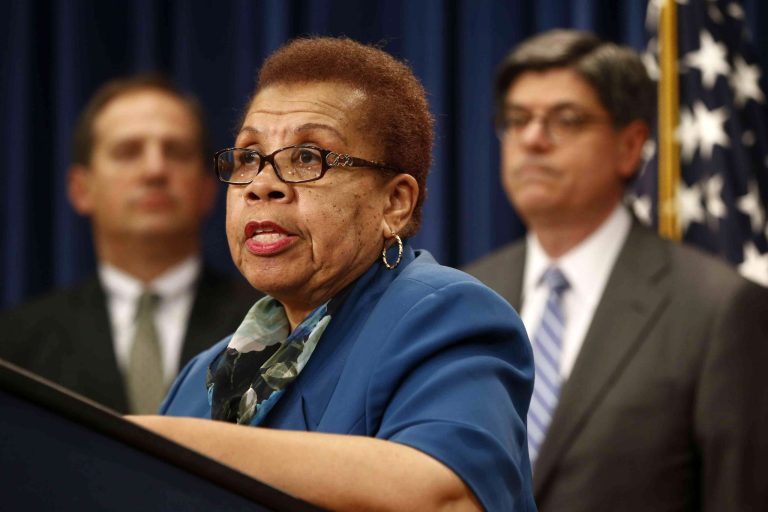 FILE - In this May 31, 2013, file photo, acting Social Security Commissioner Carolyn W. Colvin, center, accompanied by Acting Labor Secretary Seth D. Harris, left, and Treasury Secretary Jacob Lew, speaks during a news conference about Social Security and Medicare in Washington. The Social Security Administration is suspending a program in which thousands of people were having their tax refunds seized to recoup overpayments that happened more than a decade ago. Colvin said Monday, April 14, 2014, she has directed an immediate halt to the program while the agency does a review. (AP Photo/Charles Dharapak, File)