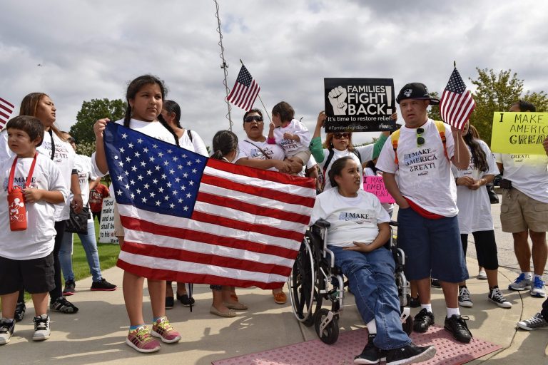 Action NC hispanic supporters participate in a rally outside the TD Convention Center in Greenville, S.C., Thursday, Aug. 27, 2015, where Republican presidential candidate Donald Trump was due to speak. (AP Photo/Richard Shiro)