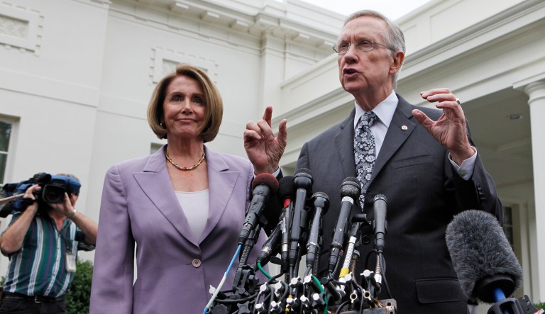 Senate Majority Leader Harry Reid and House Speaker Nancy Pelosi praised the final stimulus plan in 2009. But what was the result of the grand bipartisan moment? Resentment from rank-and-file Democrats. (AP Photo/Charles Dharapak, File)