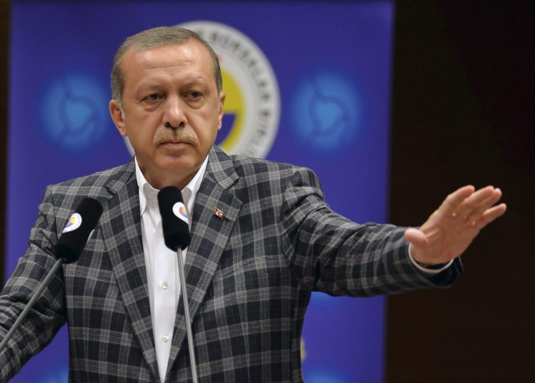 In this Thursday, Aug. 7, 2014 photo, Turkish Prime Minister and presidential candidate Recep Tayyip Erdogan addresses a business meeting in Ankara, Turkey. Turkey holds its first direct presidential elections on Sunday, Aug. 10, 2014, when voters will be tasked with choosing between three candidates for the post, which until now has been largely ceremonial. The 60-year-old Erdogan, who has dominated Turkish politics for the past decade, is widely expected to win, possibly even in the first round. A gifted public orator who grew up in a tough neighborhood of Istanbul, Erdogan leads the Islamic-rooted Justice and Development Party, or AKP, whose support base is the Turkish heartland. (AP Photo)