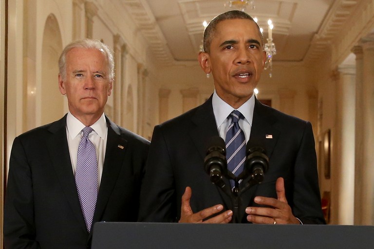 President Obama, standing with Vice President Joe Biden, delivers remarks in the East Room of the White House in Washington, Tuesday, July 14, 2015, after an Iran nuclear deal is reached. (AP Photo/Andrew Harnik, Pool)