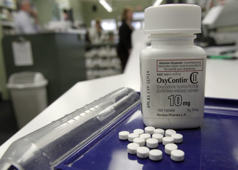 Doctors may feel pressure to prescribe opioids because it may lead to a better score on a patient satisfaction survey, experts said. (AP Photo)