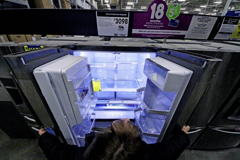 In this Thursday, Jan. 16, 2014, photo, a General Electric refrigerator is displayed at a Lowe's store in Cranberry Township, Pa.  The Commerce Department releases durable goods report for December, on Tuesday, Jan. 28, 2014. (AP Photo/Gene J. Puskar)