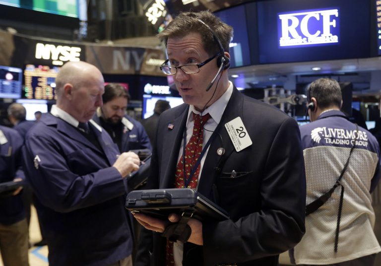 FILE - In this Wednesday, Feb. 26, 2014, file photo, Trader Christopher Forbes, center, works on the floor of the New York Stock Exchange. The stock market is little changed as investors pick over more earnings reports from retailers and other U.S. companies. (AP Photo/Richard Drew, File)