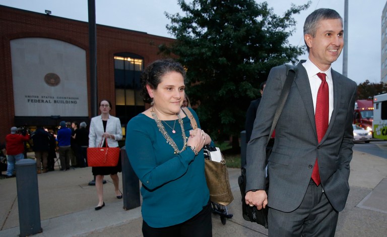 It's up to a jury now to decide whether former U.Va. dean Nicole Eramo, shown above with her attorney Tom Clare, deserves millions of dollars from Rolling Stone after the magazine published a now-discredited article alleging the school administrator didn't care about sexual assault accusers. (AP Photo/Steve Helber)