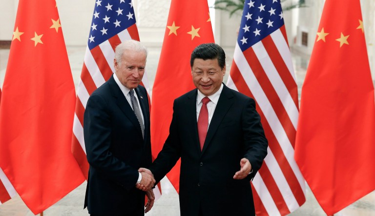 FILE - This combination image shows U.S. President Joe Biden in Washington, Nov. 6, 2021, and China's President Xi Jinping in BrasÃ­lia, Brazil, Nov. 13, 2019. 