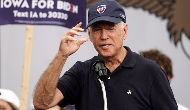 Democratic presidential candidate and former Vice President Joe Biden puts on a Beau Biden Foundation hat while speaking at the Polk County Democrats Steak Fry, in Des Moines, Iowa, Saturday, Sept. 21, 2019.