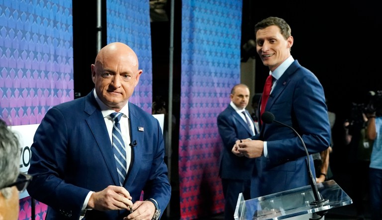 Arizona Democratic Sen. Mark Kelly, left, Republican challenger Blake Masters, right, and Libertarian Marc Victor, back.