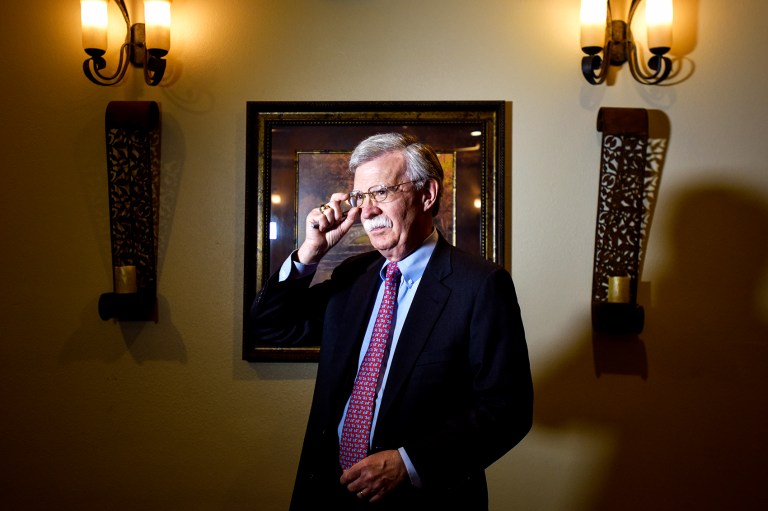 President Donald Trump, left, shakes hands with national security adviser John Bolton in the Cabinet Room of the White House in Washington, Monday, April 9, 2018, at the start of a meeting with military leaders.