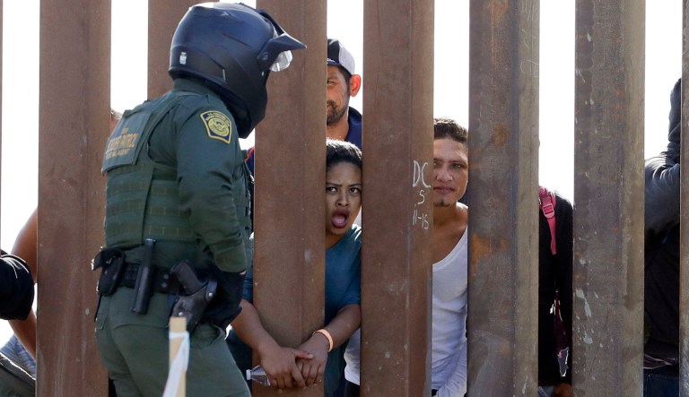 A Mexican soldier patrols along the U.S.-Mexico border wall on the outskirts of Nogales, Mexico, Tuesday, April 1, 2008.