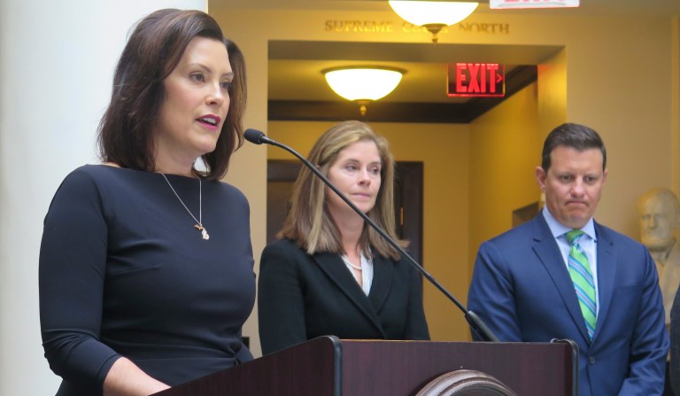Michigan Gov. Gretchen Whitmer, left, announces the creation of a bipartisan task force to review Michigan's jail and pretrial incarceration system on April 17, 2019, outside the state Supreme Court chambers. Joining Whitmer are Michigan Supreme Court Chief Justice Bridget McCormack, center, and Michigan Association of Counties Executive Director Stephan Currie.